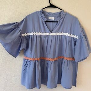 Elegant Blue Blouse with White and Pink Accents